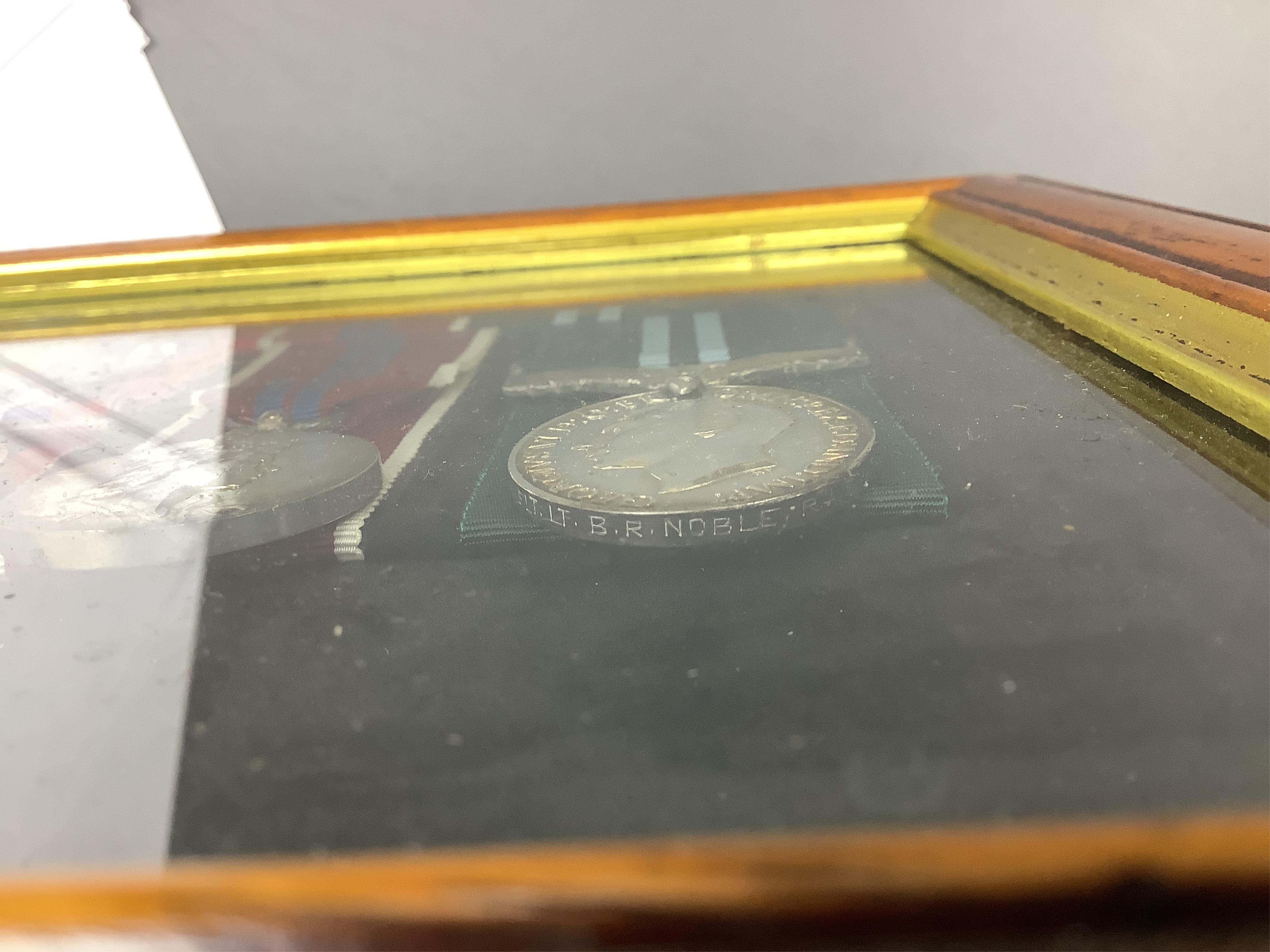 A framed WWII RAF medal group awarded to Wing Commander Brian Robert Noble, comprising;, The 1939-1945 Star, with clasp for the Battle of Britain, The Air Crew Europe Star, The Defence Medal, The British War Medal, The 1